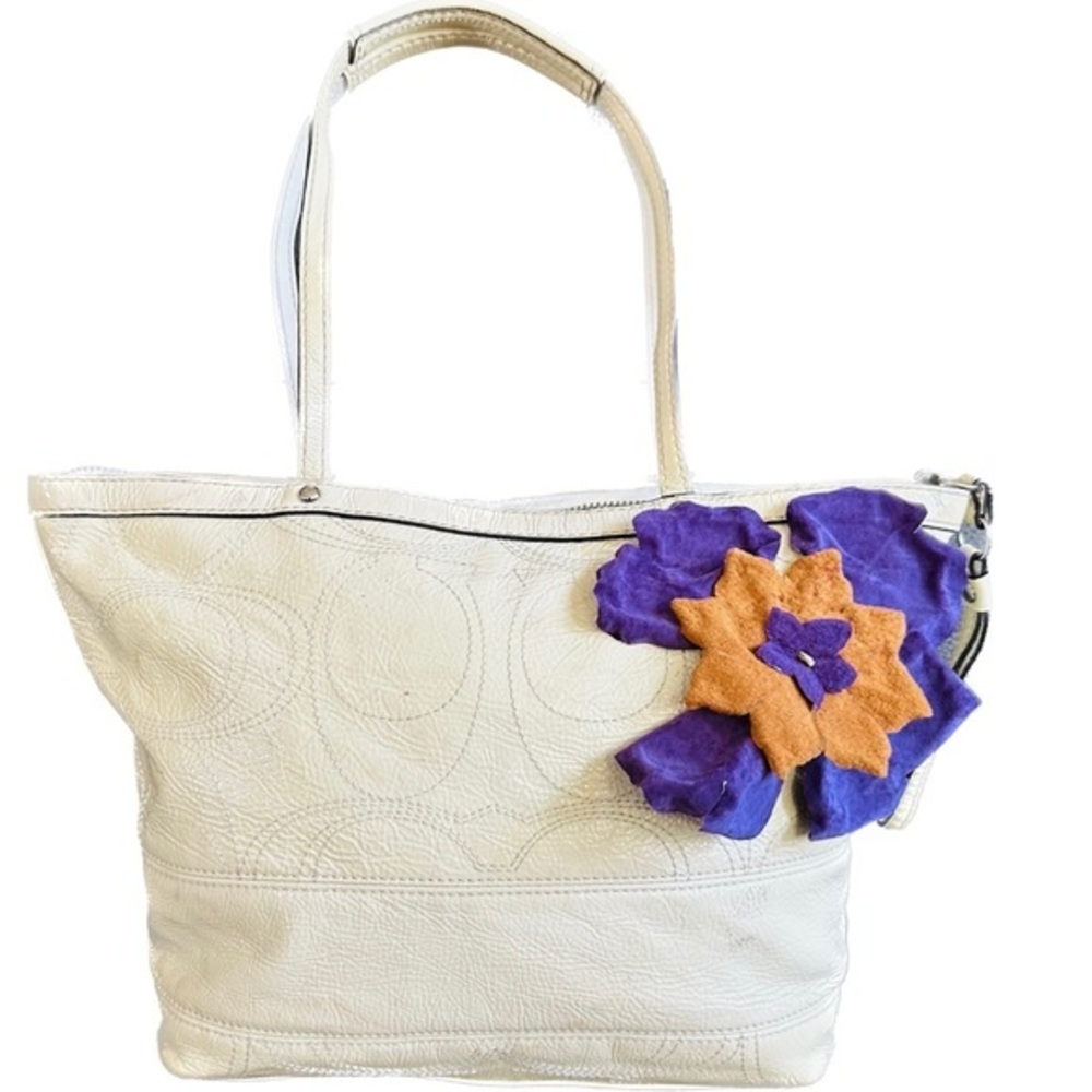 Coach patent leather purse with green interior and purple saddle tan flower.cute